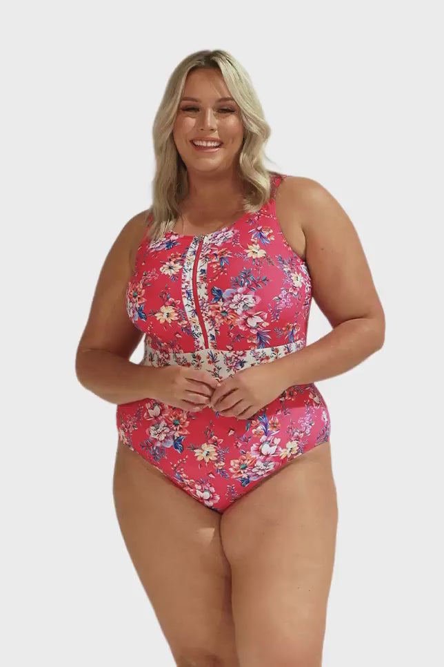 Model wearing hot pink floral sleeveless one piece swimsuit