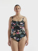 model wearing black floral chlorine resistant swimsuit