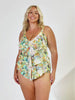 Blonde woman in studio wearing ruffled tankini top