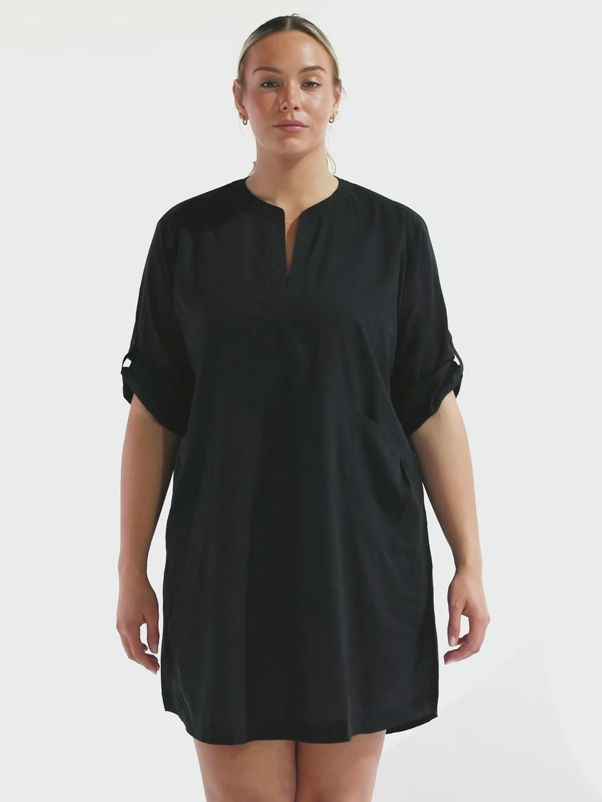 model wearing black over shirt dress