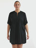 model wearing black over shirt dress