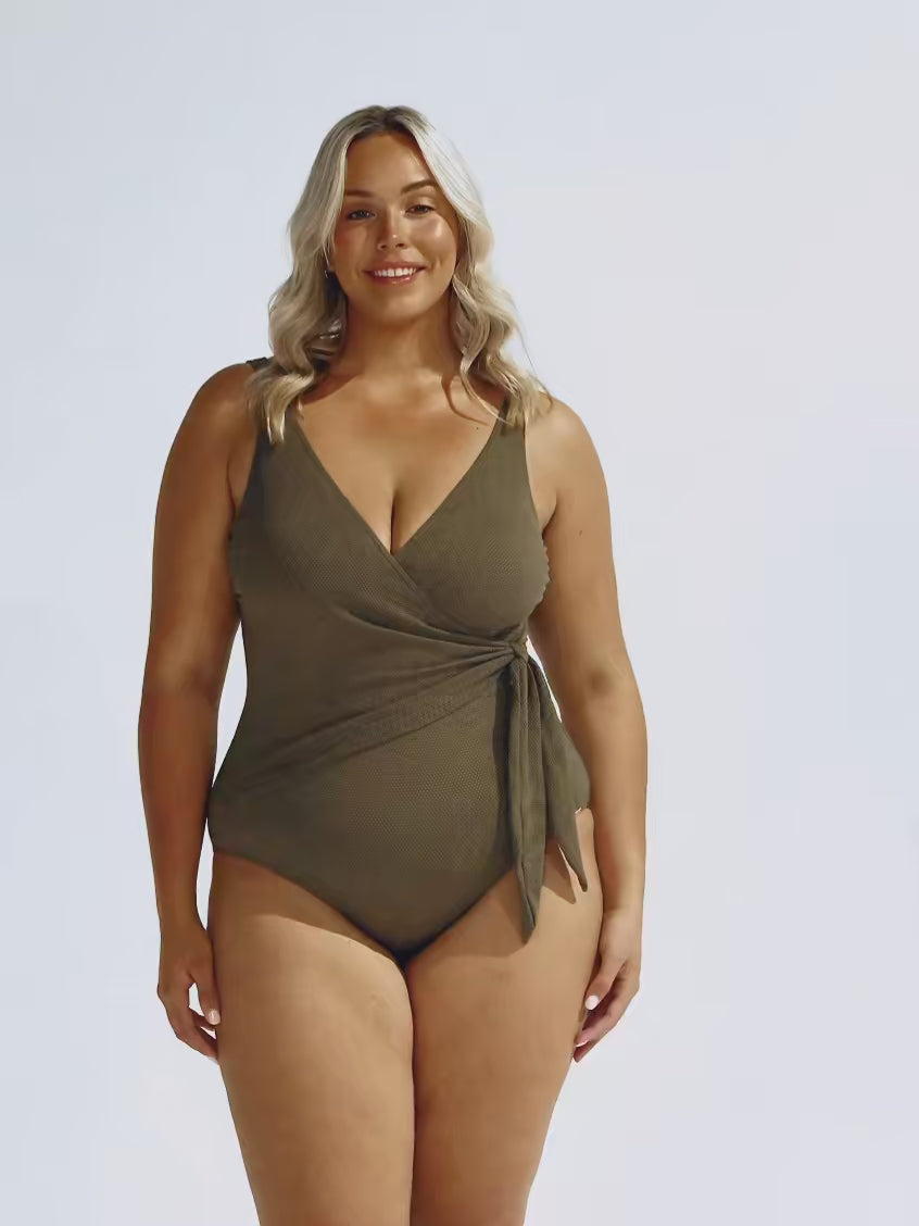 Video of blonde model wearing khaki wrap one piece