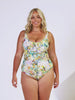 Blonde women in studio wearing a tank one piece in tropical print