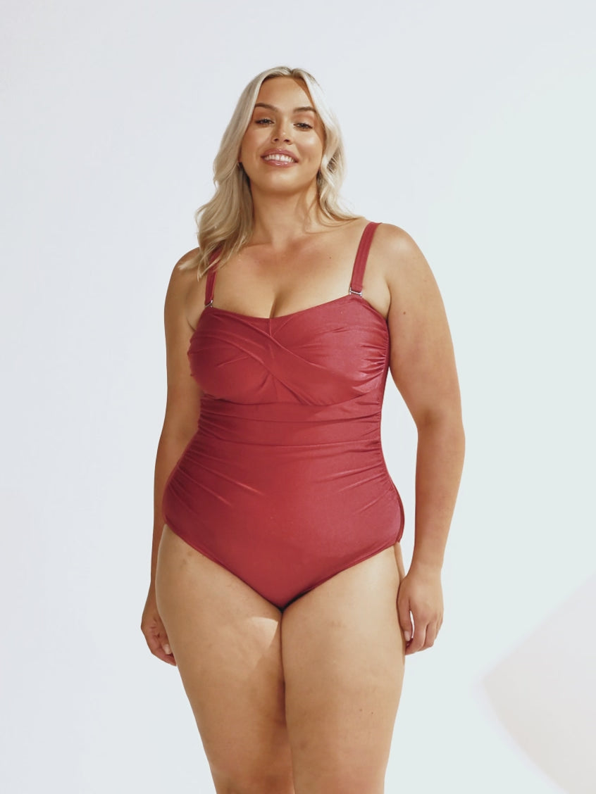 Blonde model wearing a twist front bandeau in metallic deep red