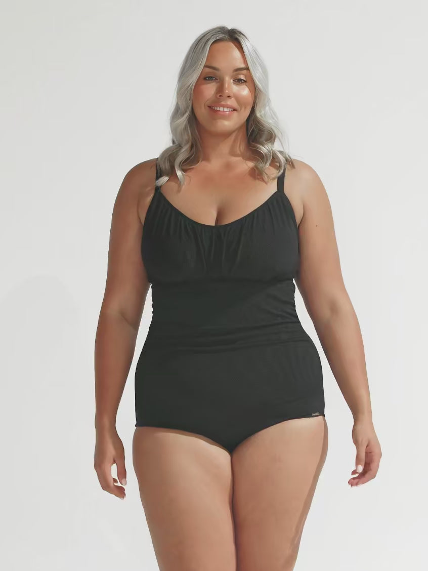 model wearing black textured underwire one piece