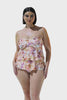 Brunette model wearing blush pink floral tiered tankini swim top