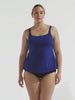 model wearing navy chlorine resistant tankini top