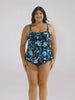 Brunette model in studio wearing a floral blue tankini top 