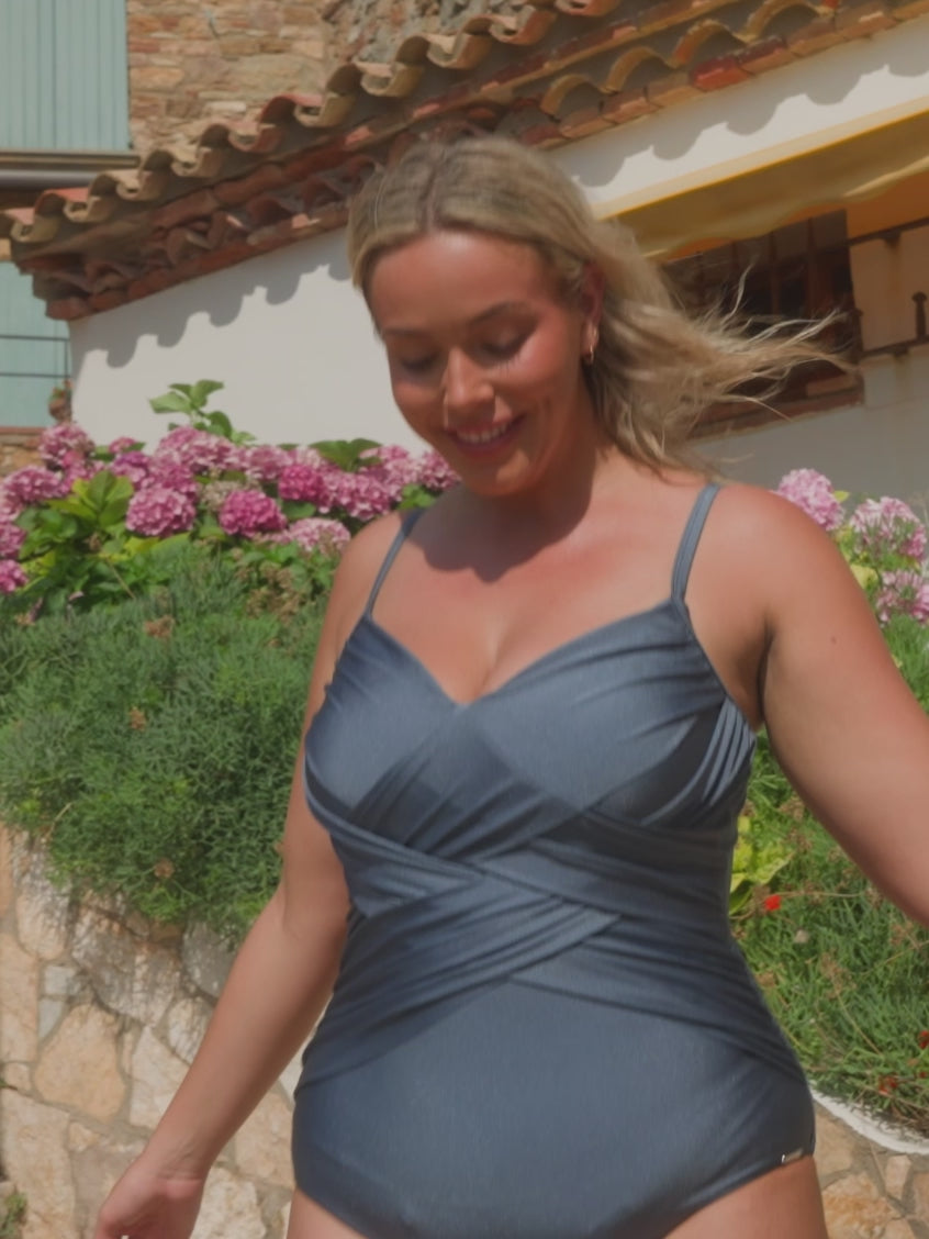 Blonde model in metallic criss cross one piece with adjustable straps