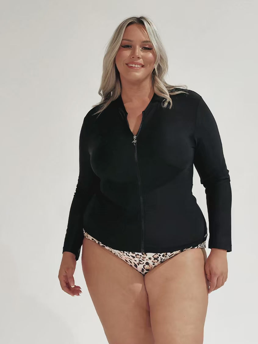 Model showing off long sleeve rash vest with full zip front detail