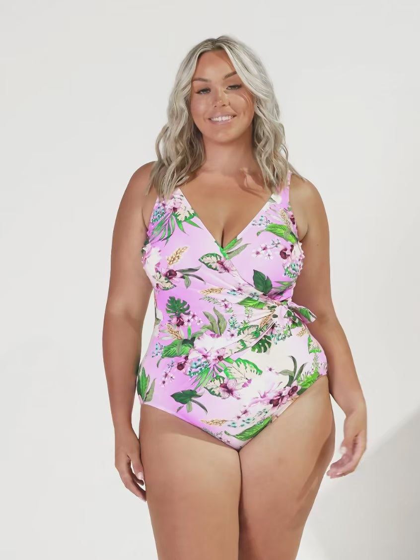 Blonde model in studio wearing a neck one piece with waist tie detail