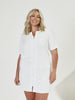 Woman wearing white terry towellling beach coverup dress in studio