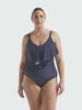 model wearing navy and white dots frill one piece