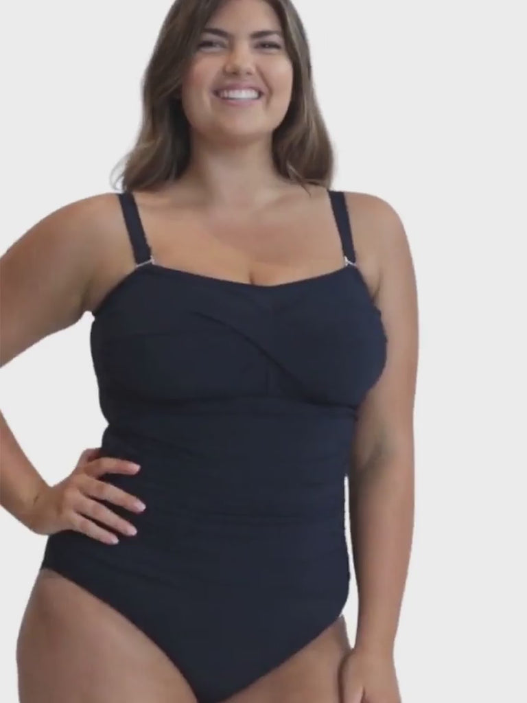 model wearing navy honey comb bandeau swimsuit