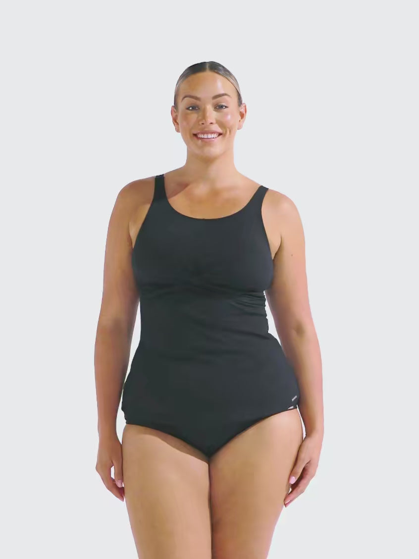 Video of woman in studio wearing a high neck tankini top in chlorine resistant