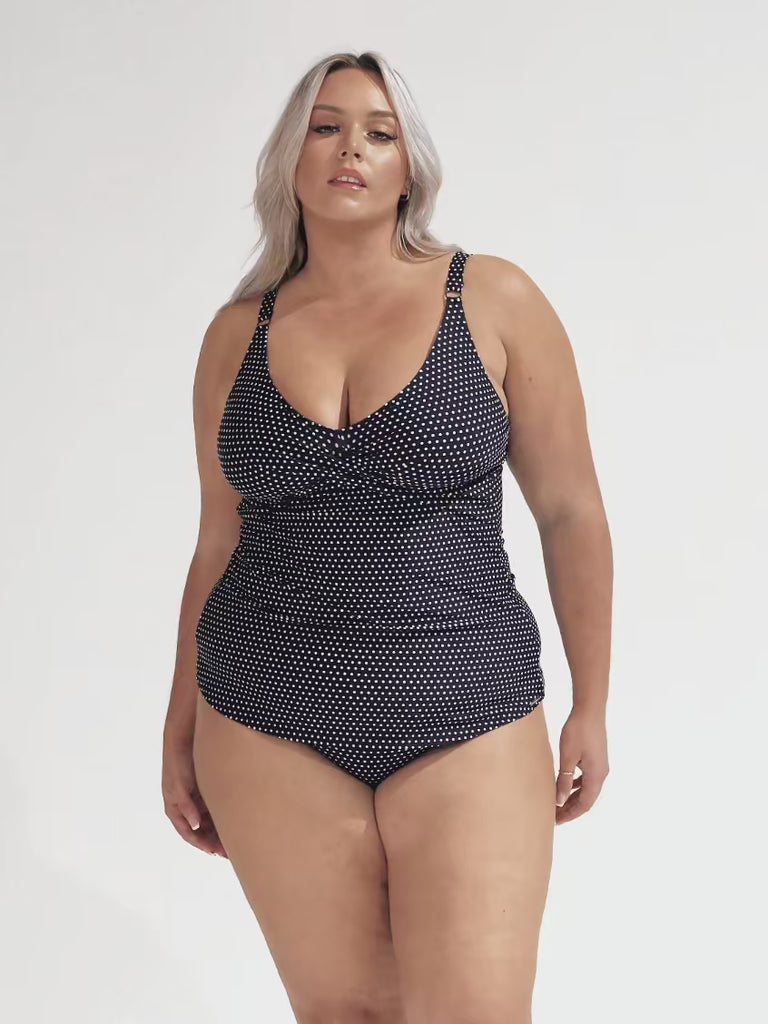 model wearing navy swing tankini and matching bottom