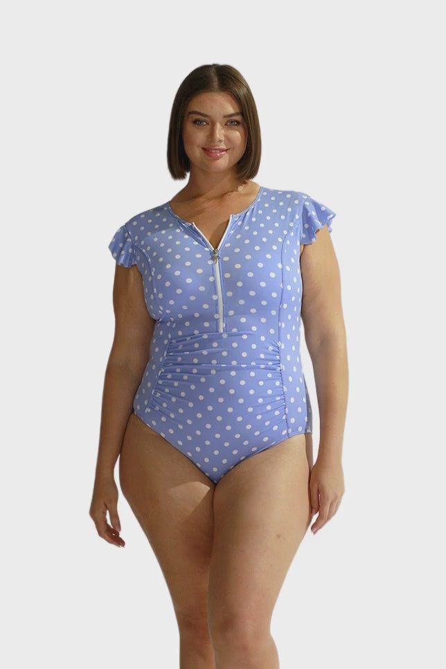 Model wearing Chlorine Resistant Blue Polkadot Zip Front One Piece Swimsuit with Frill Sleeves
