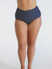 Woman wearing navy white dots high waisted pant