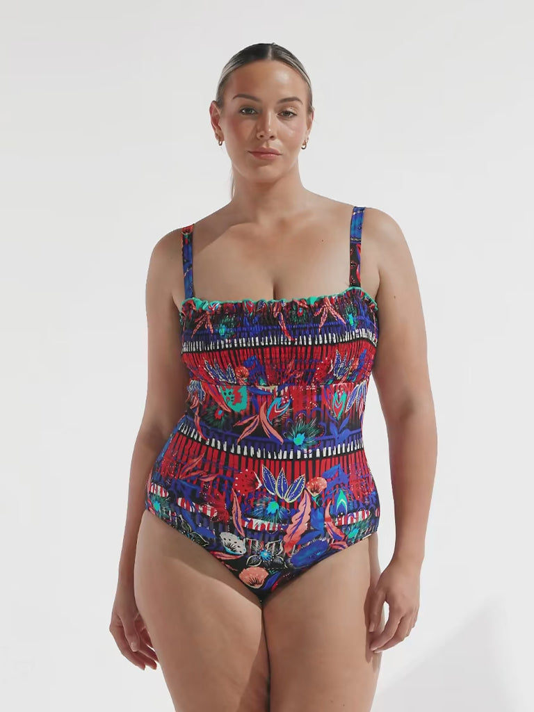 model wearing bright multi-coloured one piece