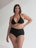 model wearing black triangle bikini top and high waisted pant