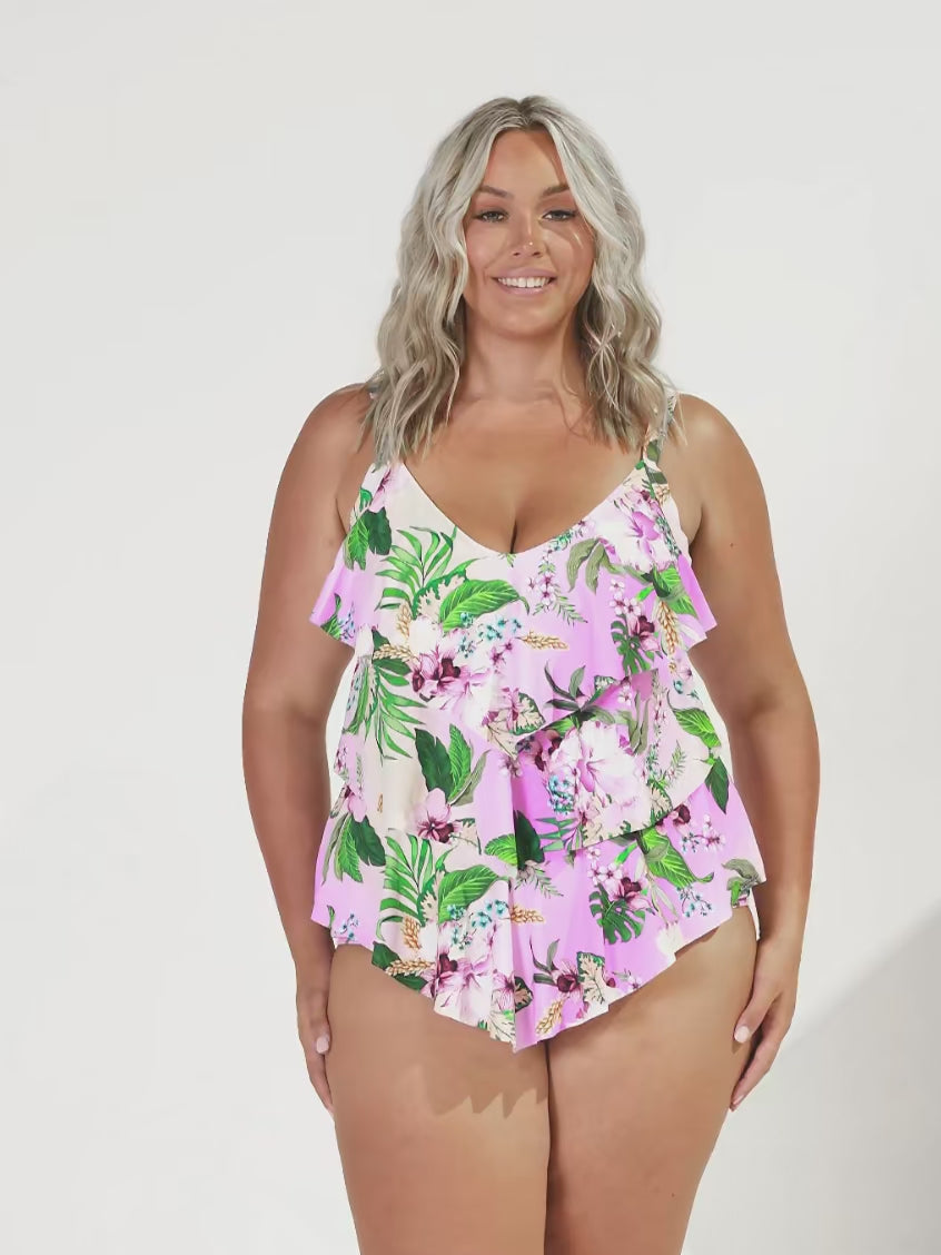 model wearing pink floral 3 tier tankini