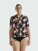 Model in studio showing off short sleeve rash vest in floral print 