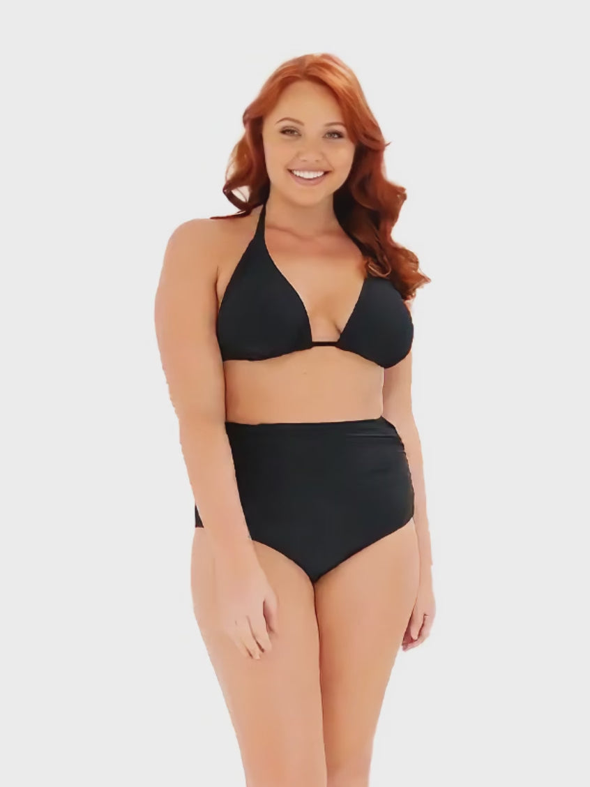 model wearing black ruched swim pant with matching bikini top