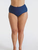 Model in studio wearing a plain navy high waisted pant