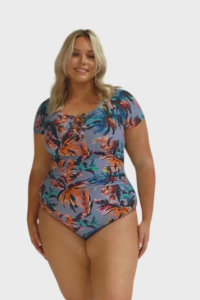 Model wearing blue-grey short sleeve one piece swimsuit