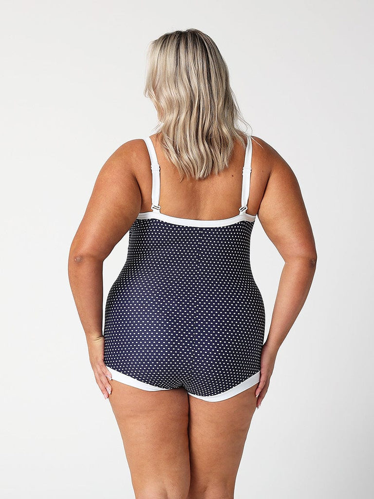 model showing back of navy dots boyleg swimsuit