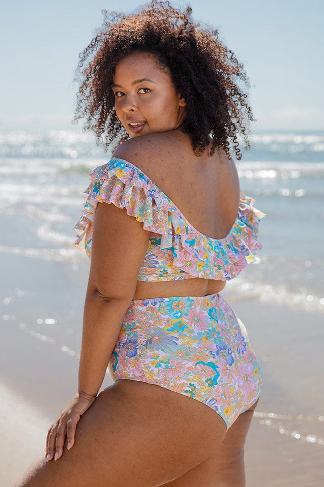 Model wearing multi coloured high waisted floral bikini pant