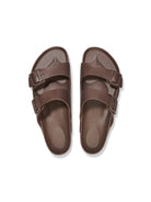 Pair of brown sandals on a white background