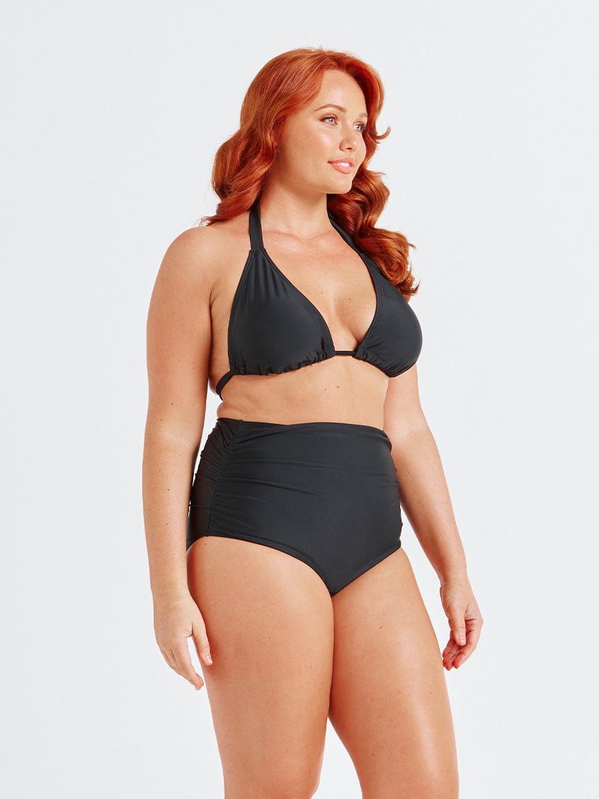 model showing side ruching on black swim bottom