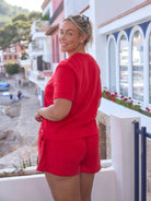 model showing back of red terry towelling shorts