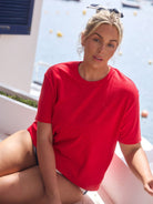 model wearing red terry towelling shirt