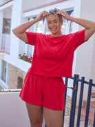 model wearing red terry towelling set
