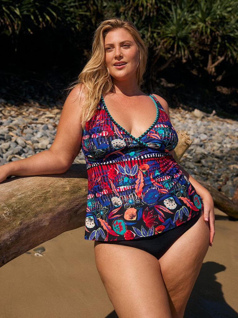 model wearing bright multi-coloured tankini at beach