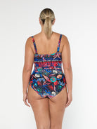 model showing back of bright patterned swimsuit