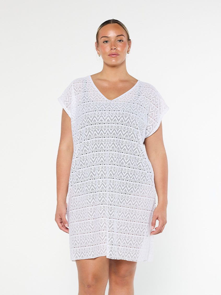 model wearing white mesh beach cover up