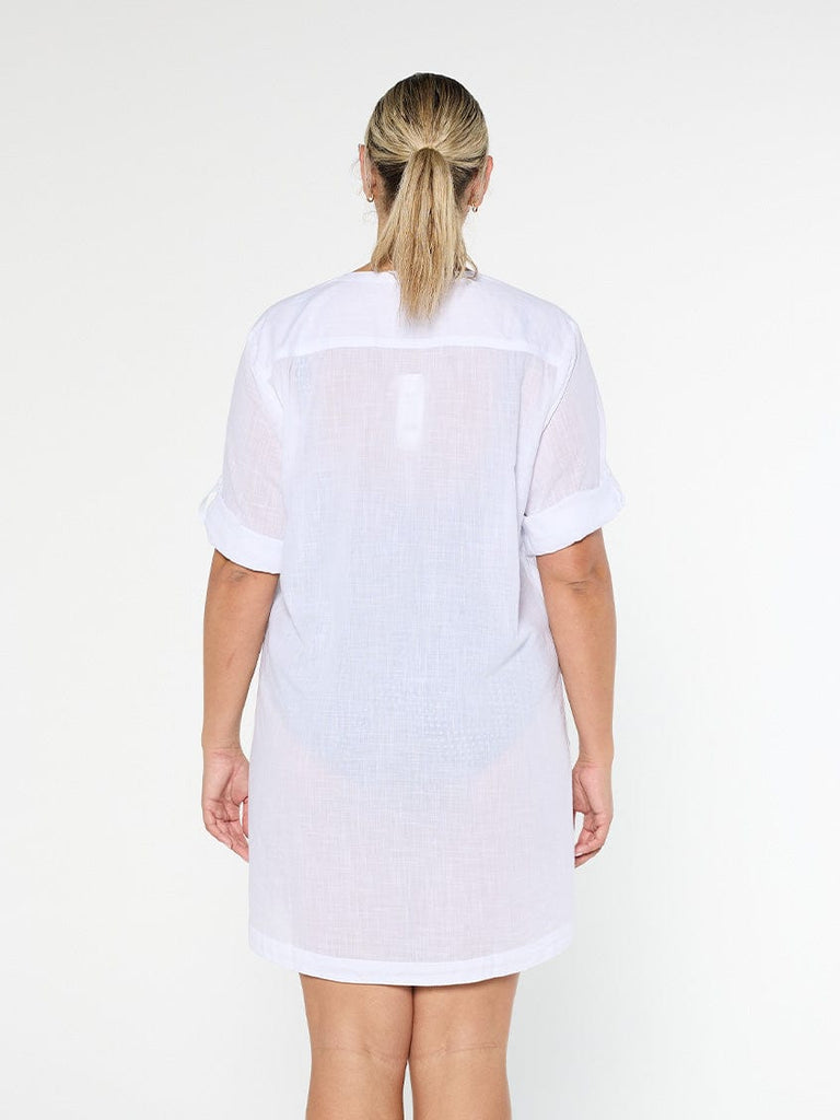 model showing back of white beach cover up
