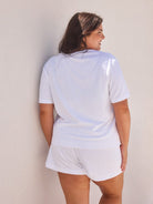 model showing back of white terry towelling shirt