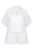 ghost mannequin of white short set, top with collar and button through and matching shorts