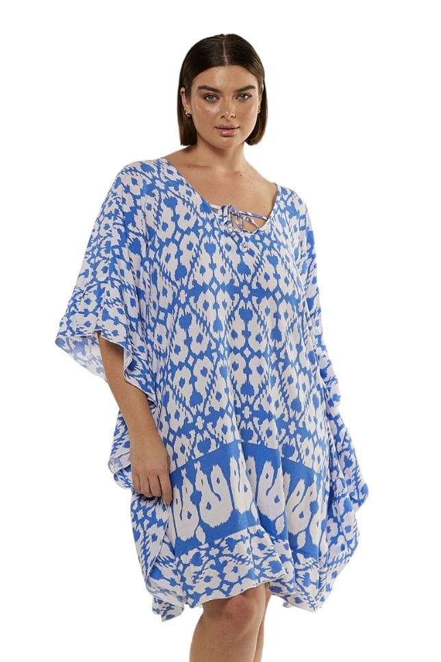 brunette model wearing powder blue and white womens beach cover up with tie front detail