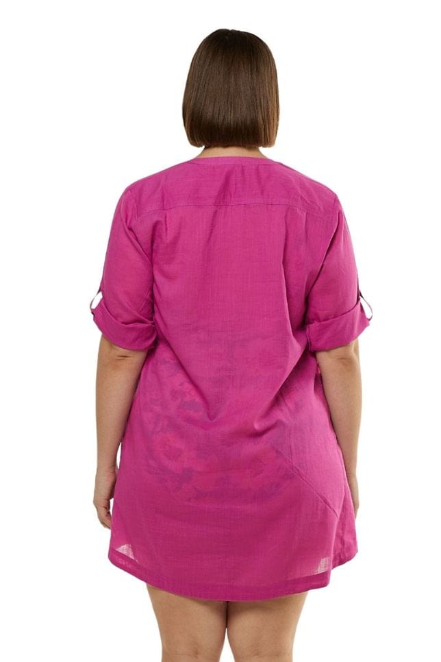 Back of model wearing pink beach overshirt