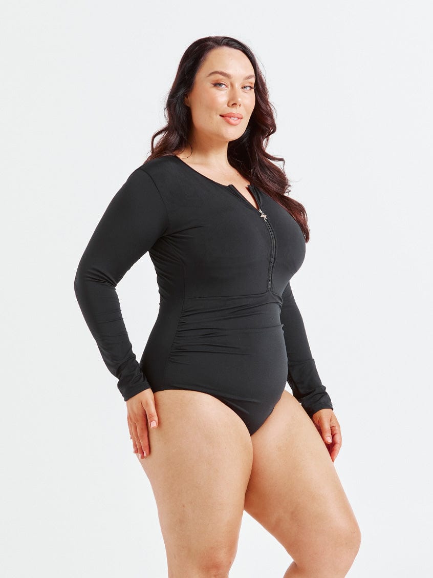 model showing side of black long sleeve one piece swimsuit