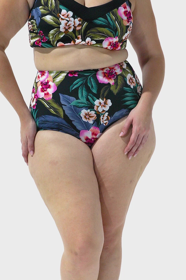 Video of model wearing floral high waisted bikini bottoms
