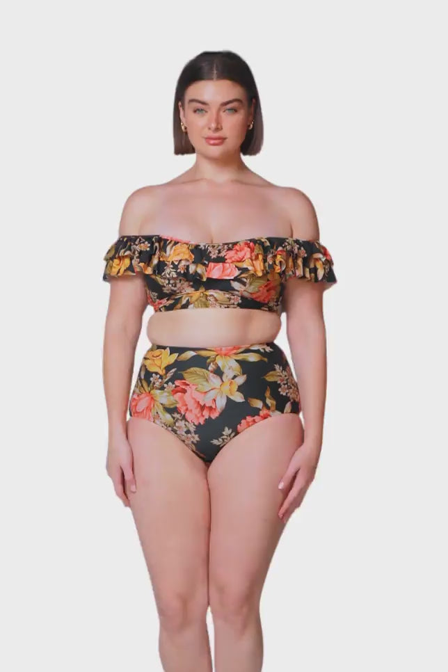brown haired women wearing cute black floral double ruffle bikini top with matching high waisted bikini swim bottom