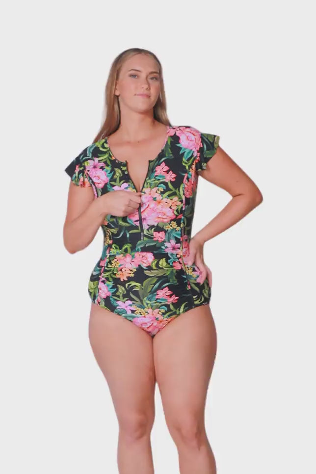 blonde model wearing tropical floral frill sleeve one piece