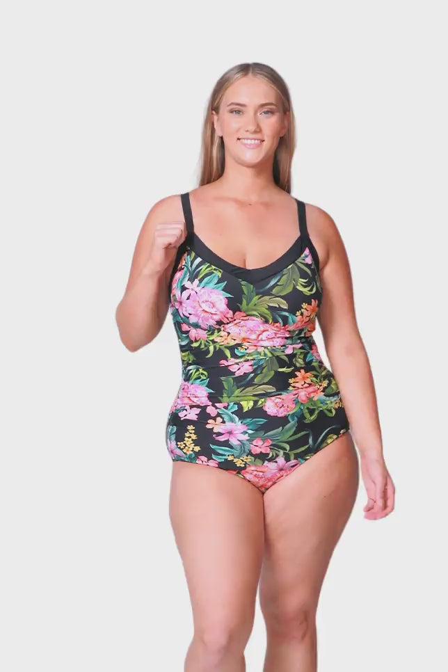plus size blonde model wears tropical floral one piece with underwire
