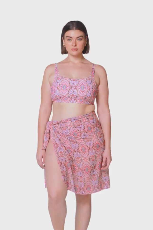 brunette size 14 model wearing mesh tie side skirt in pink mosaic print